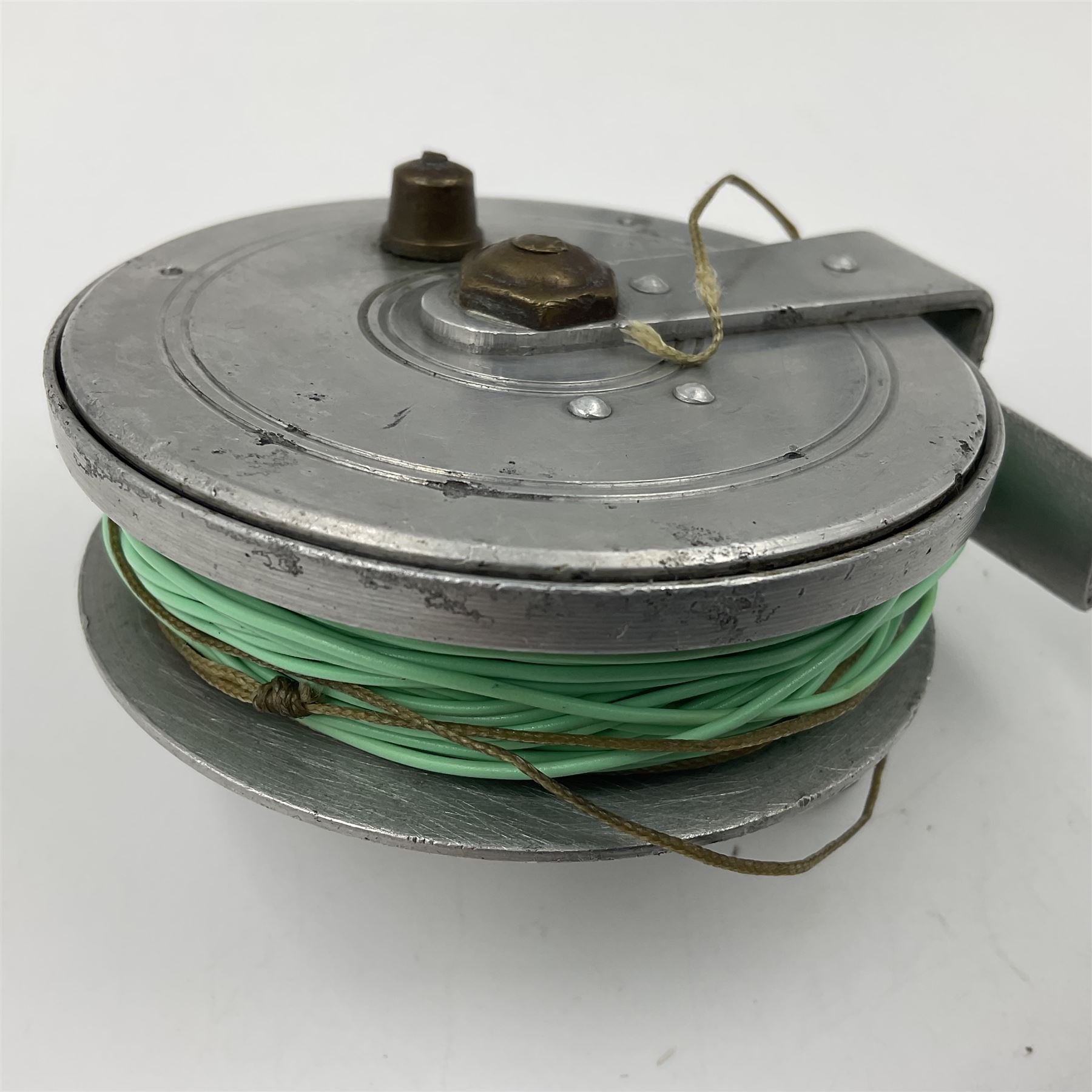 TO RTV Three fishing reels, including American Pflueger progress bulldog size 60 brass and chrome skeleton fly reel, with wooden handle; Maginot 106 fly reel and an alloy reel (3)