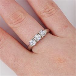 Platinum diamond three stone ring, each four claw set with a round brilliant cut diamond, hallmarked, total diamond weight approx 1.00 carat