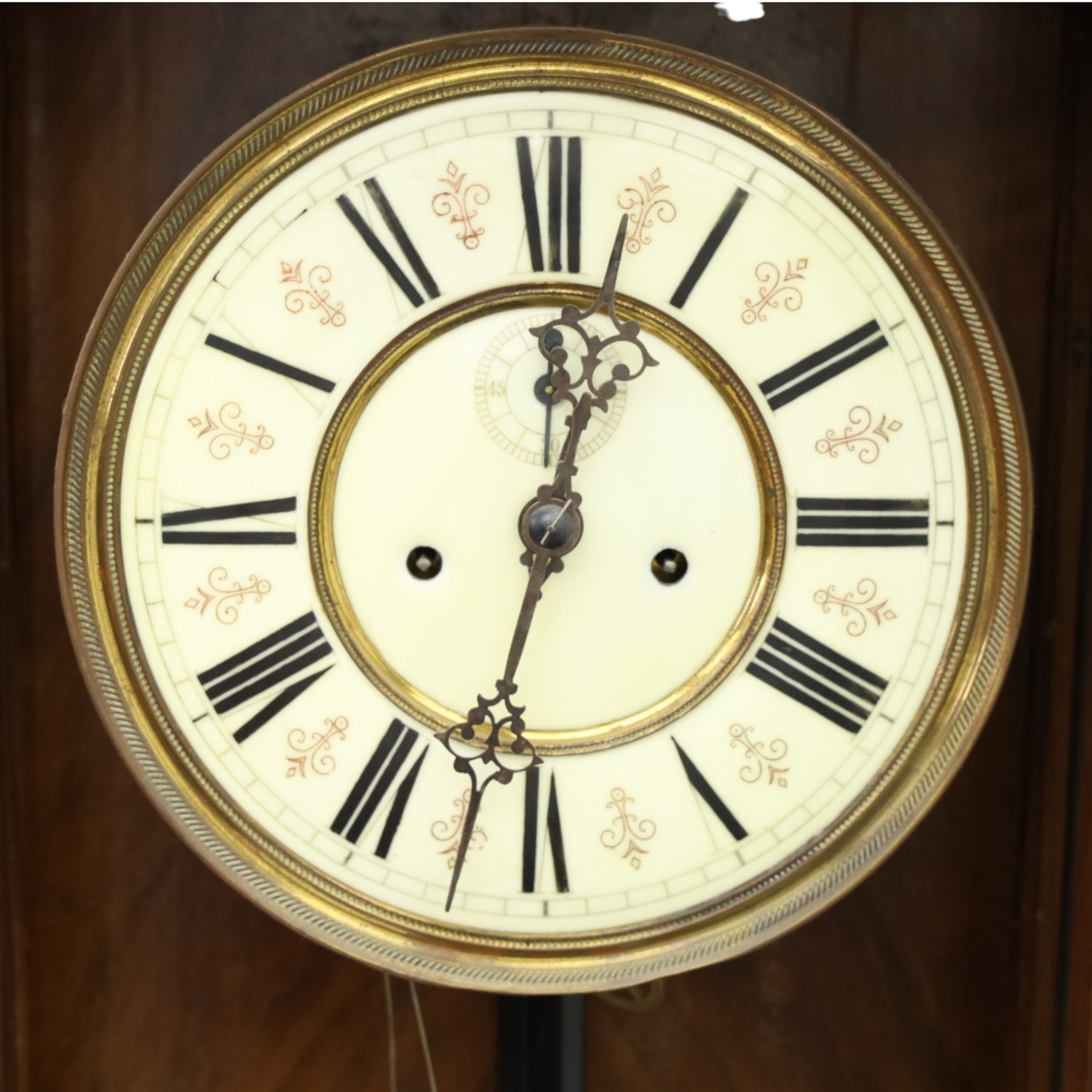 19th century mahogany Vienna Regulator wall clock, carved mahogany framed with turned and half-canted pilasters, over a lobed terminal