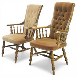 Near pair of late 20th century oak high back armchair, upholstered in brown fabric with buttoned back and close-nailed borders, shaped arms on turned supports, over a stuff-over seat, raised on turned legs united by stretchers
