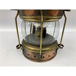 Copper and brass ship’s lamp marked ‘Anchor’, H25cm, Feuer hand storm lantern, Bialaddin Model 315 paraffin lamp and an Anchor lamp (4)
