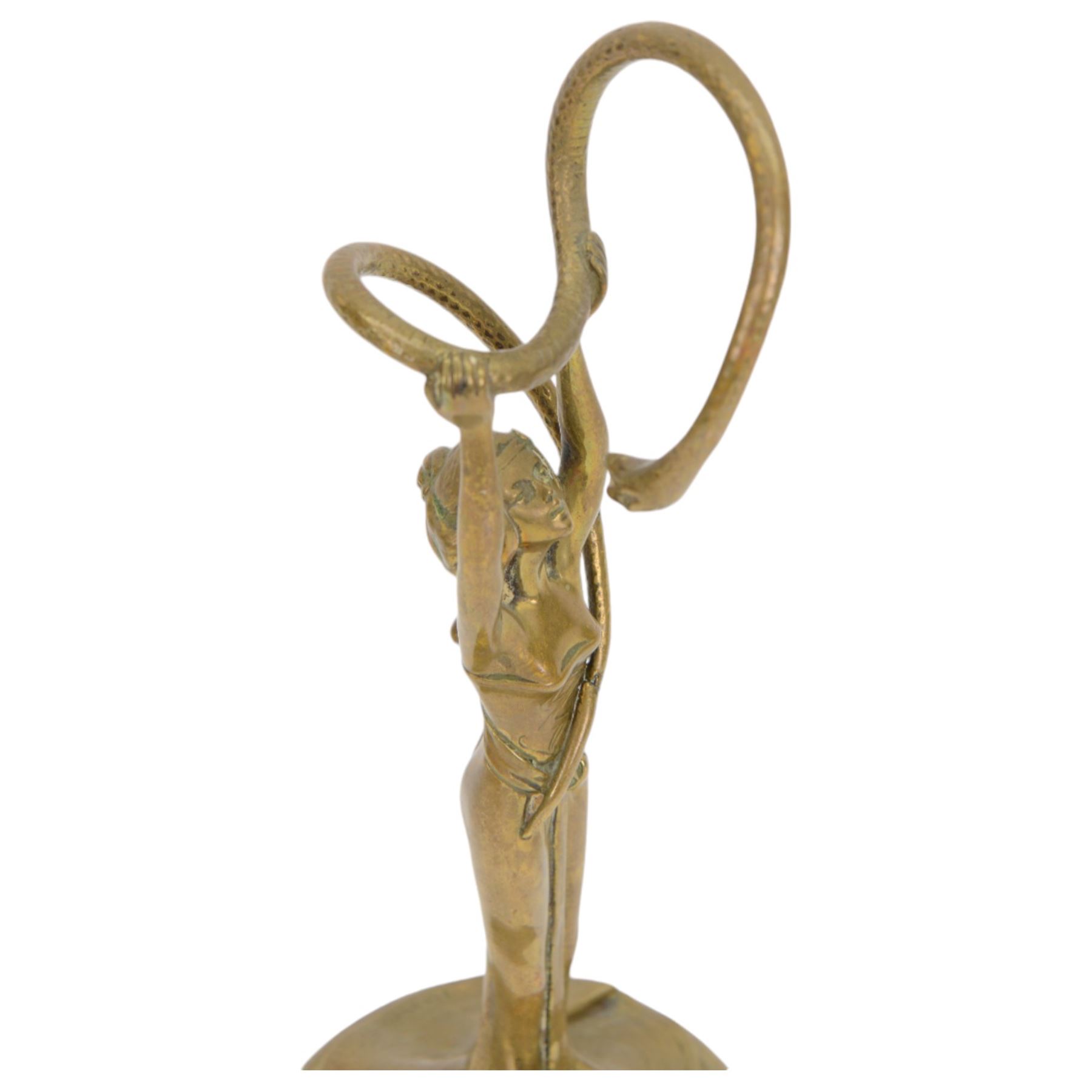After Francis Renaud, Art Nouveau style cast brass figure of a woman holding aloft a serpent, marked Renaud to base, H26cm