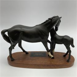 A Beswick figure modelled as Black Beauty and Foal, matt glaze, upon oval wooden base, overall H19cm L29.5cm. 