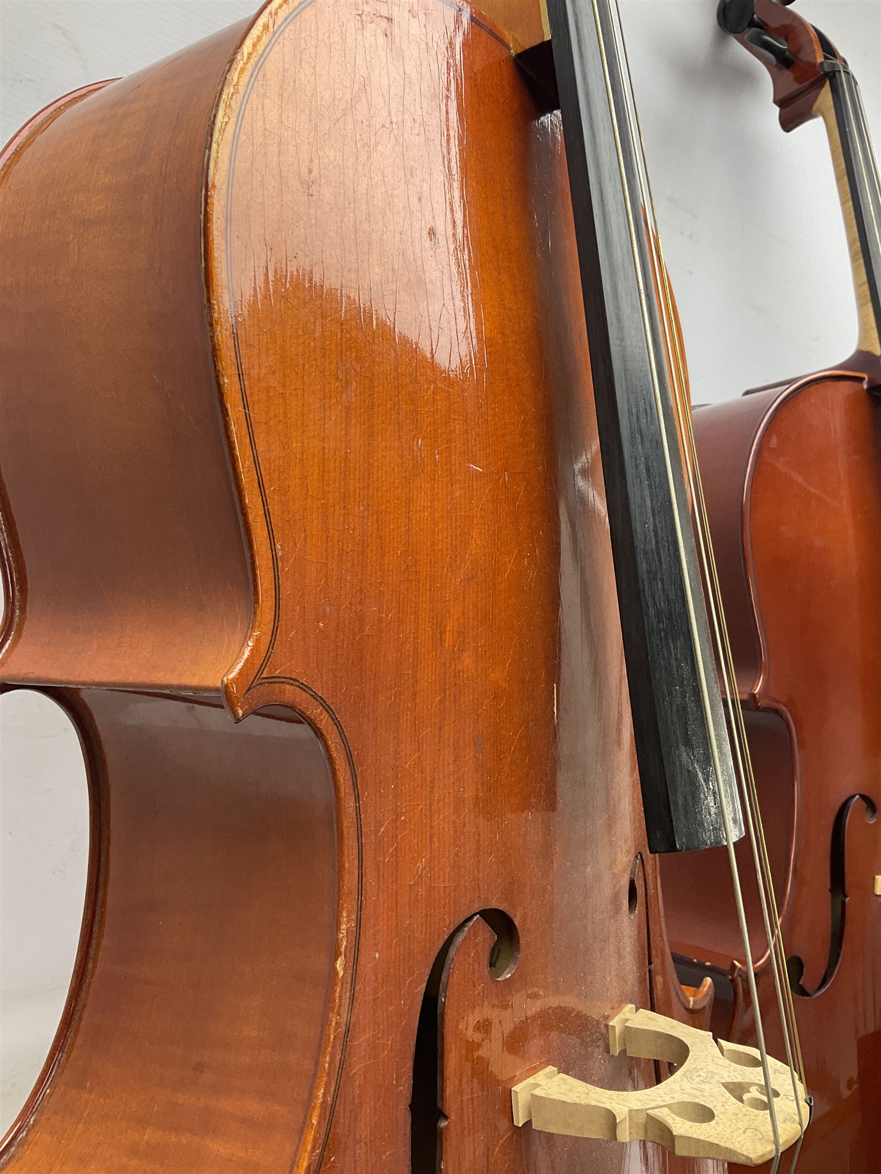 Modern Hungarian half-size cello with 69cm two-piece maple back and ribs and spruce top L114cm overall; and Stentor half size cello bearing label 'The Stentor Student II'; each in soft carrying case (2)