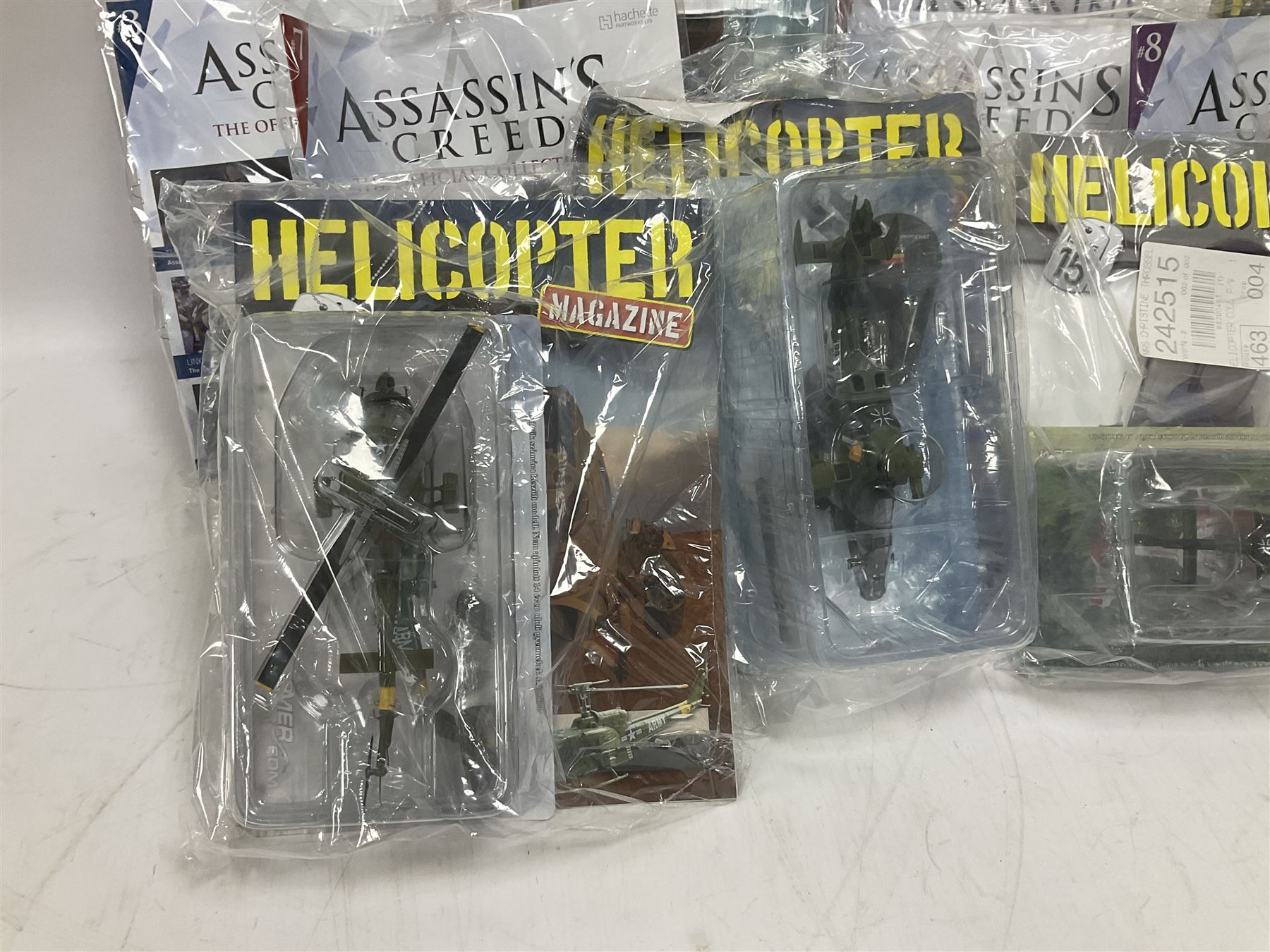 Fifteen Amer Czechoslovakia periodical issued metal models of helicopters each in unopened original packaging with copy of 'Helicopter Magazine'; together with seven unopened Hachette 'Assassin's Creed' periodical figures with magazines (22)