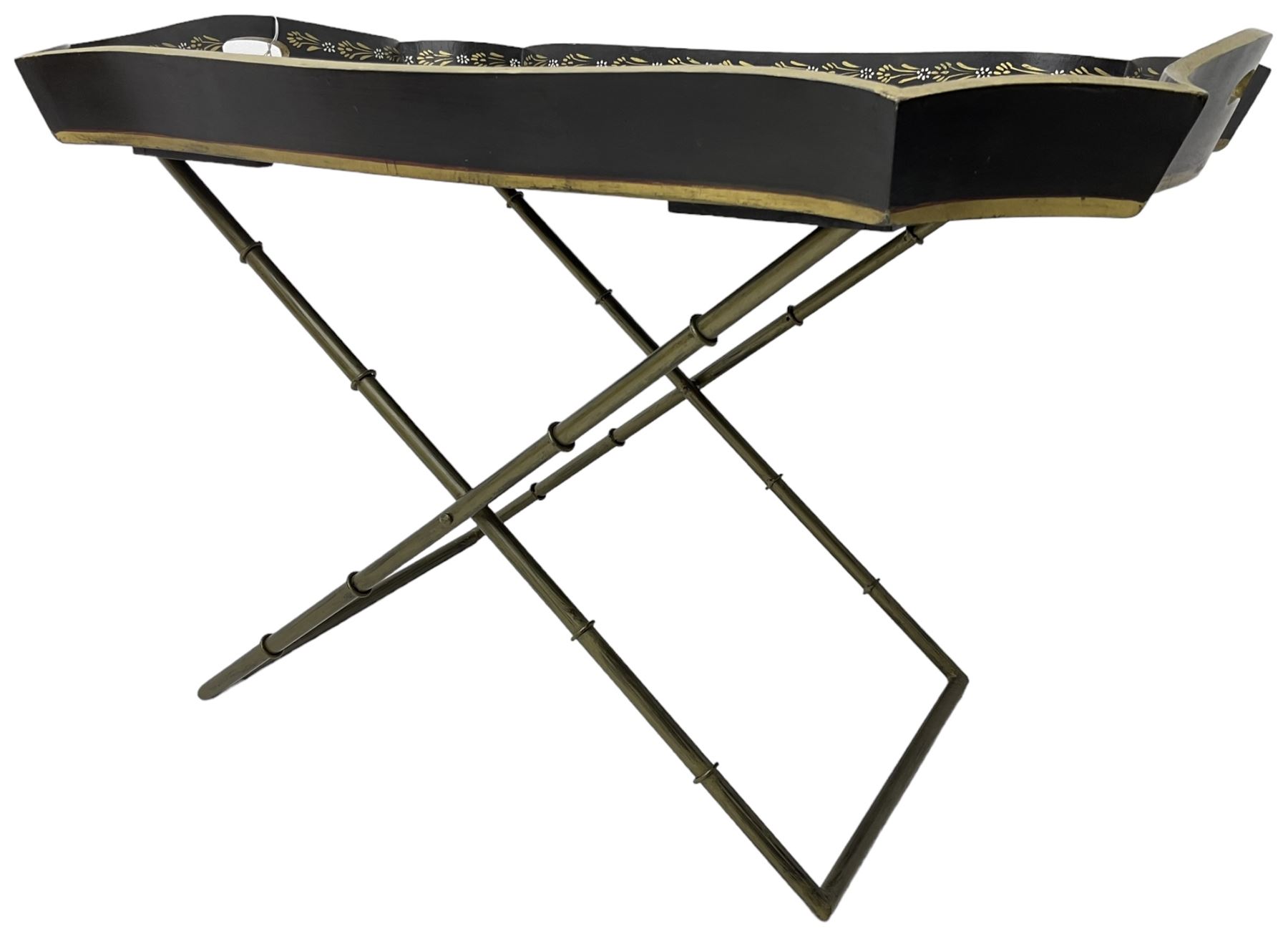 19th century design Chinoiserie style lacquered tray, painted with traditional scenes with figures and pagodas with gilt detail, on a folding simulated bamboo metal stand