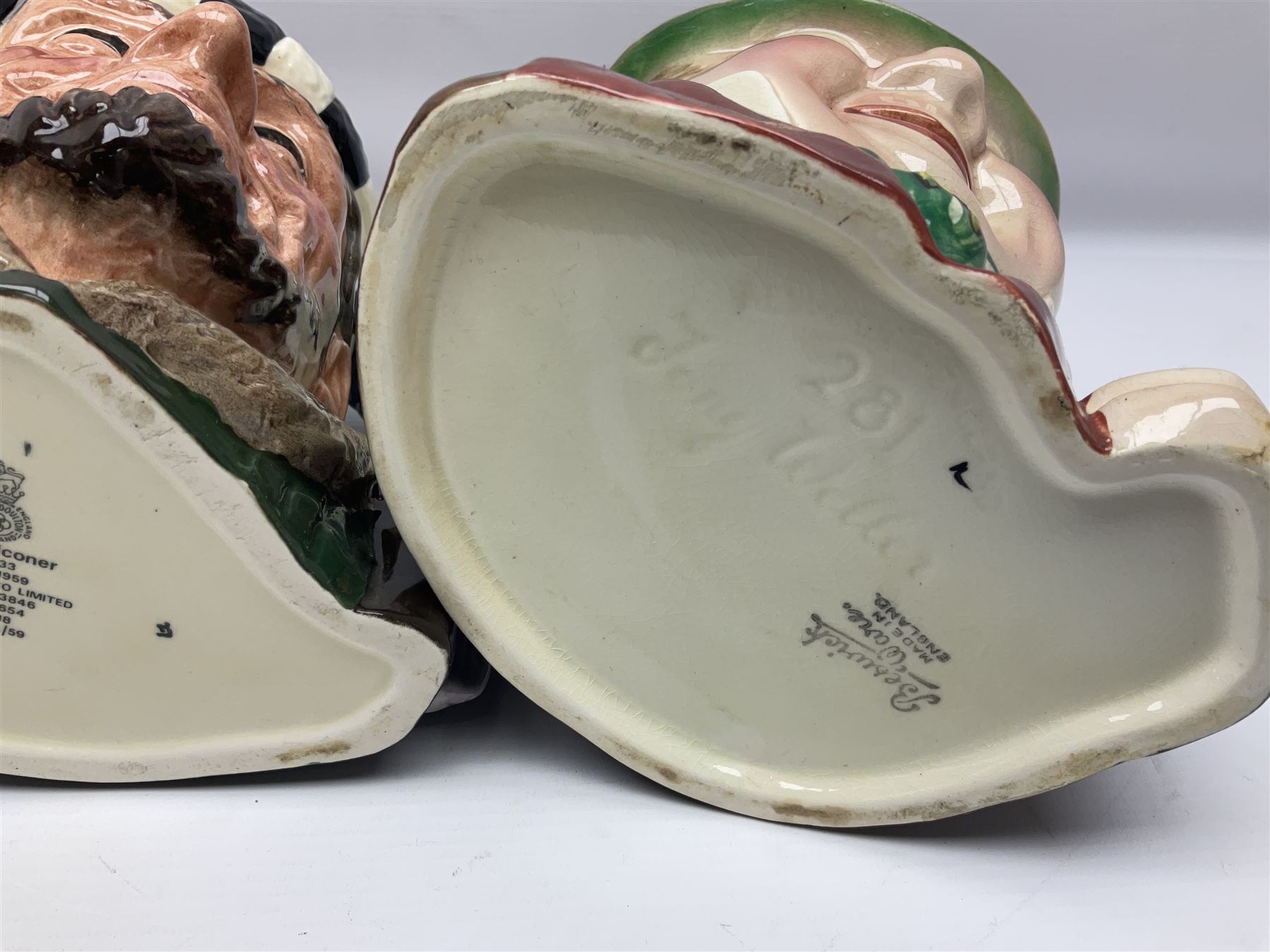 Collection of Royal Doulton and Beswick character jugs of various sizes, including North American Indian D6611, The Falconer D6533,  Tony Weller 281, Sairey Gamp 371 etc