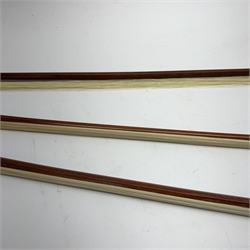 Three pernambuco bows by F.C. Pfretzschner with silver mounts, Adolf Thoma and Tourte