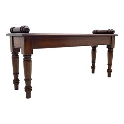 Victorian style mahogany window seat, the moulded rectangular top set with two turned mounts, plain frieze stretchers, on turned supports