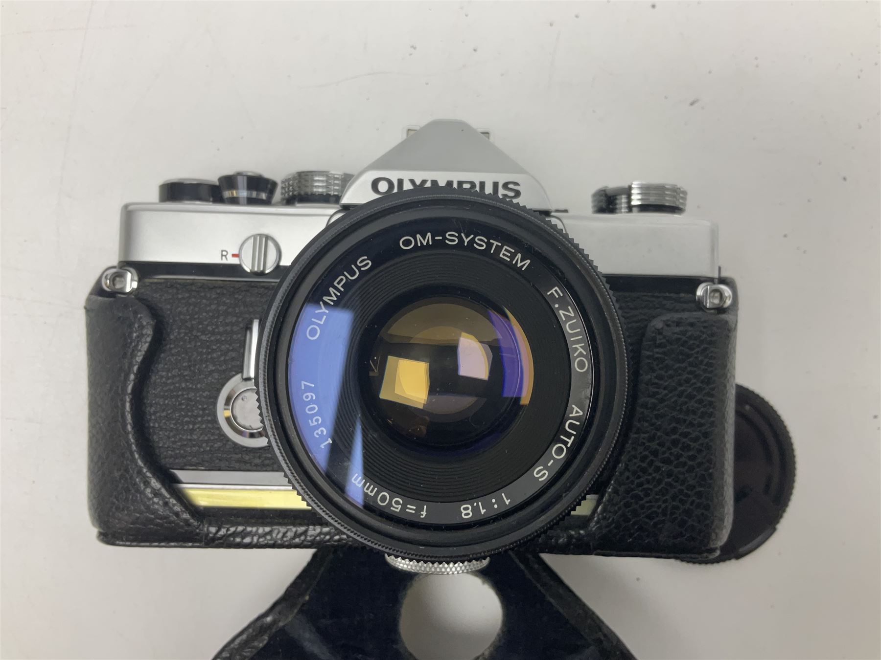 Collection of camera bodies and lenses, to include Olympus OM-1 camera body, serial no 106567, with 'Olympus OM-System F.Zuiko Auto-S 1:1.8 f=50mm' lens, serial no 135097,  Zenit-B camera body, serial no 71017867, with 'Helios-44-2 2/58' serial no 7500040, Voigtlander Vito B camera body, with 'Voigtlander Colour Skopar 1:2.8/50' lens, 'Olympus OM-System Zuiko Auto-Zoom 1:4 f=75-150mm' lens serial no 104321, 'Tamron SP 35-210mm 1:3.5-4.2' lens etc 