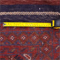 Afghan Meshwani runner, hand-knotted wool pile, indigo ground decorated with a vertical series of angular diamond medallions in tones of madder red, dark blue, framed by geometric borders with flatwoven kilim ends with fringe 