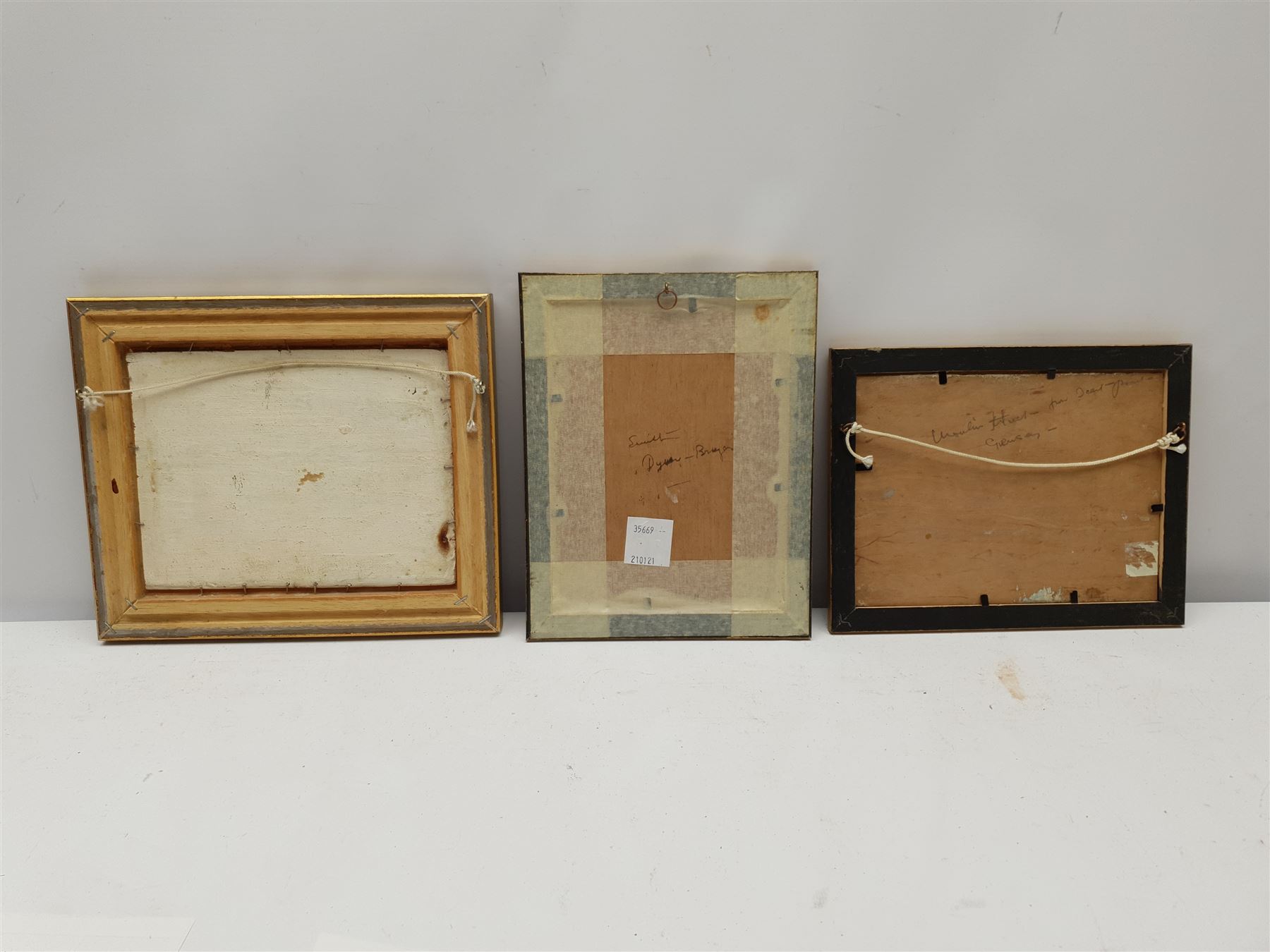 Harry Edmunds Crute (British 1888-1975): Cornish Beach Scene, oil on board signed 15cm x 19cm, together with two similar oils one signed Smith, inscribed verso 14cm x 19cm (3)