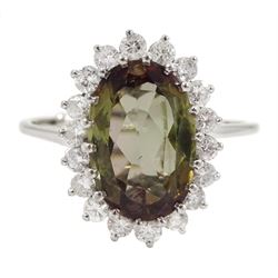 White gold oval andalusite and diamond cluster ring, stamped 18ct, andalusite approx 3.67 carat, total diamond weight approx 0.35 carat