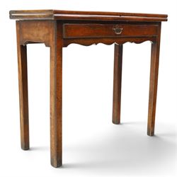 Georgian oak tea table, rectangular fold-over top above single frieze drawer with brass swing handle, shaped apron, gateleg raised on square tapering supports