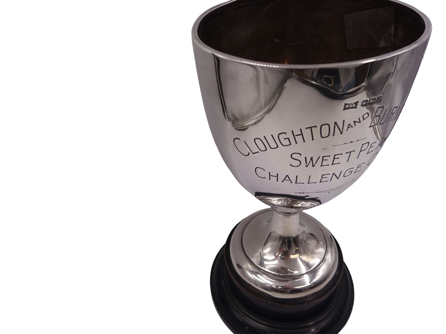 1930s silver trophy cup, of plain form, upon knopped stem and circular stepped foot, body with presentation engraving 'Cloughton and Burniston Sweet Pea Challenge Cup' with winners engraved verso, hallmarked Walker & Hall, Sheffield 1931, upon ebonised base, including base H28.7cm