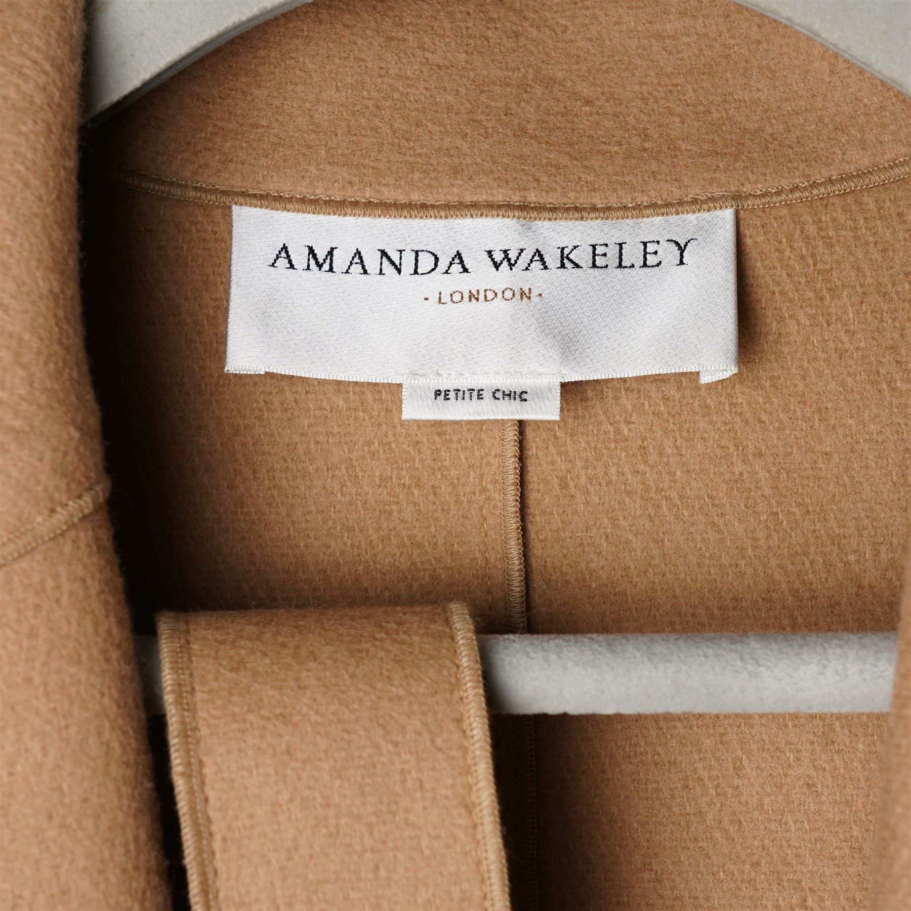 Amanda Wakeley London - full-length coat in camel wool, with notched lapels, concealed front fastening, self-tie belt, and side slip pockets, of minimalist tailored form, from the 'Petite Chic' line, unused