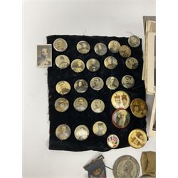 Collection of royalty medallions and postcards, royalty and military pin badges, alongside a selection of miners tallies and tokens.