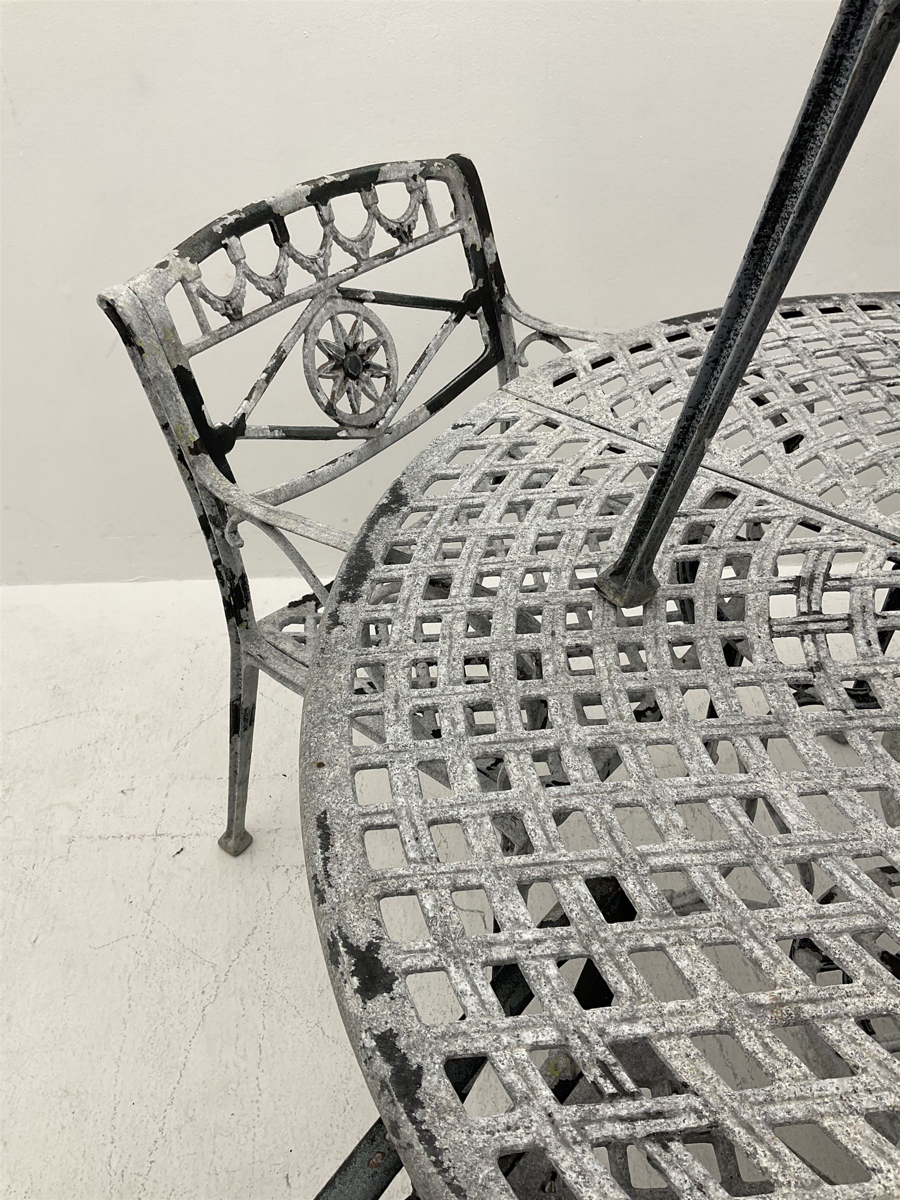 Heavy Aluminium circular garden table, and six wide seat chairs with ‘star’ backs - THIS LOT IS TO BE COLLECTED BY APPOINTMENT FROM DUGGLEBY STORAGE, GREAT HILL, EASTFIELD, SCARBOROUGH, YO11 3TX