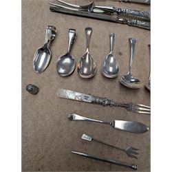 Group of silver and silver handled cutlery, including caddy spoons, thimble, propelling pencil, fruit knife, etc, all stamped or hallmarked