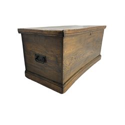 Elm blanket box, hinged lid enclosing candle box, fitted with metal carrying handles, on moulded plinth base