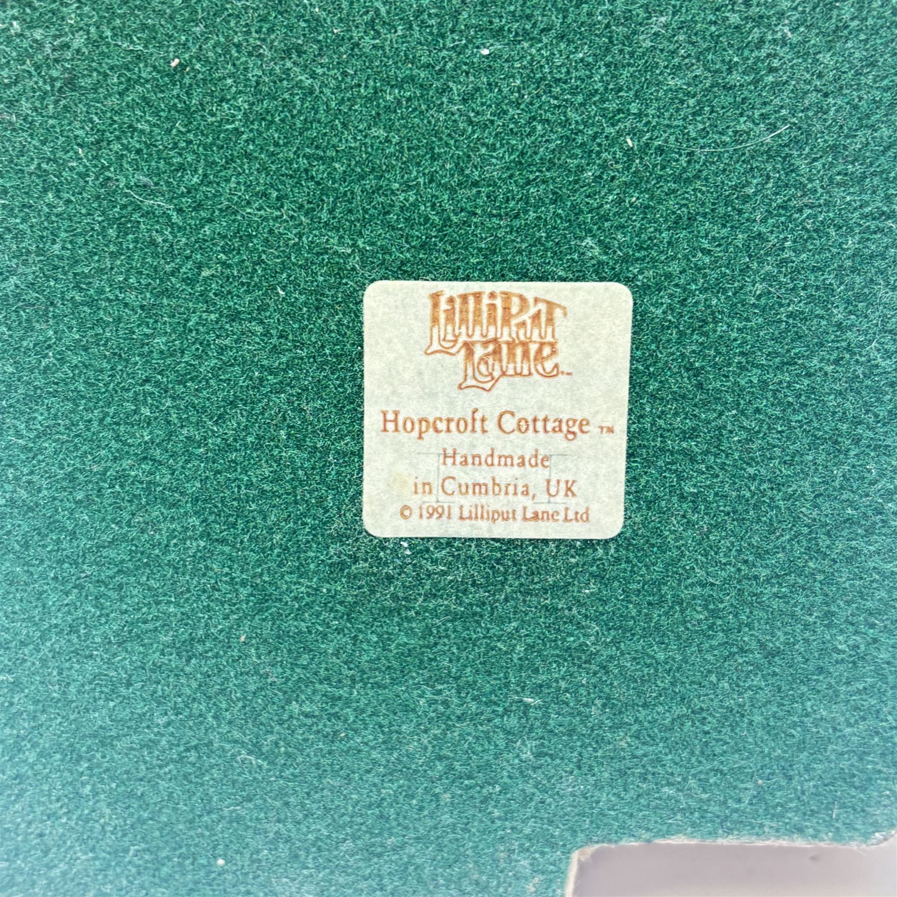 Eighteen Lilliput lanes, including Lundy Lighthouse, Bluebell Wood, St Marys, Winsor Cottage etc, all with original boxes and four limited edition Lilliput Lane prints 