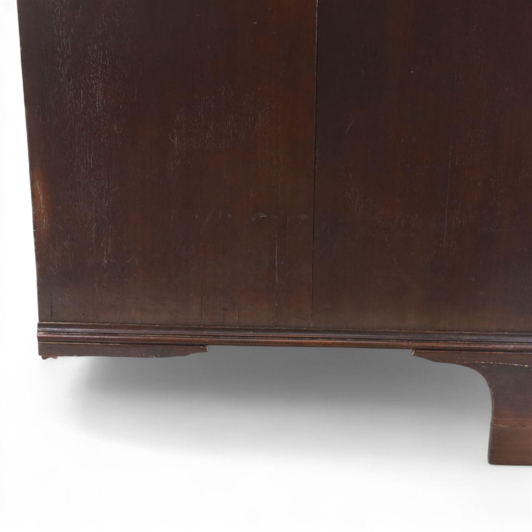 Late 19th-century Georgian-style mahogany chest of drawers, rectangular top with moulded edge over two short and three graduated drawers, raised on bracket feet, back foot missing 