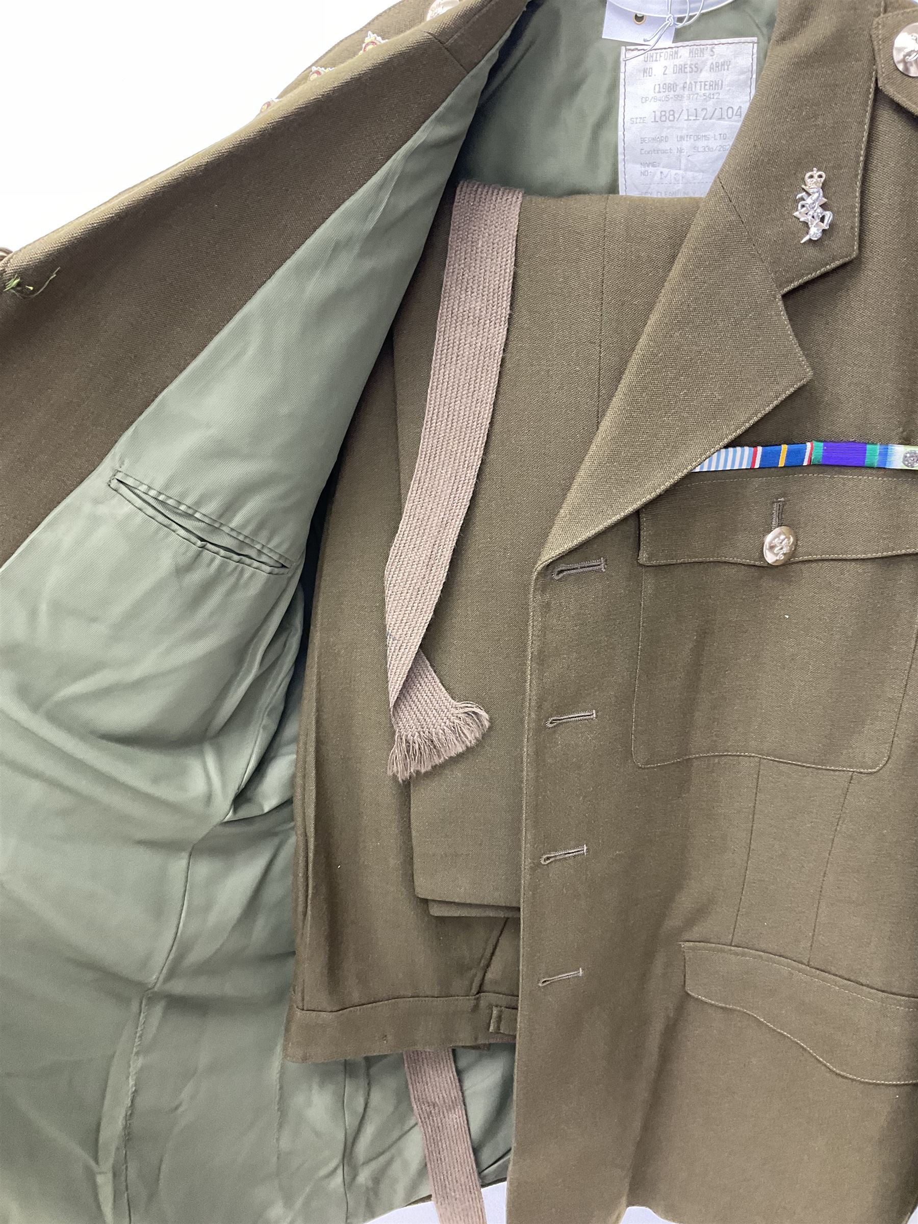 RAF Flight Lieutenant's uniform with peaked cap and WW2 ribbon bar; WW2 gas mask in blue canvas bag dated 1942; flying helmet date 1984; and British Army Major's uniform with Staybrite buttons and peaked cap