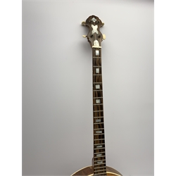 Four-string banjo guitar with mahogany circular back and sides and spruce top, mother-of-pearl inlaid fingerboard and headstock, bears humorous label 'Fender Bedpanjo', L95cm