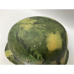 Fully restored German steel helmet, the camouflage painted exterior with two decals and replacement leather liner