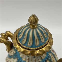 Pair of late 19th/early 20th century Sevres style vases and covers, of baluster form with gilt scroll handles and domed covers, the wrythen fluted bodies decorated with alternating bands of painted fruit and flowers and gilt vines, upon a white and celeste blue ground, with printed and impressed marks beneath, H22.5cm 