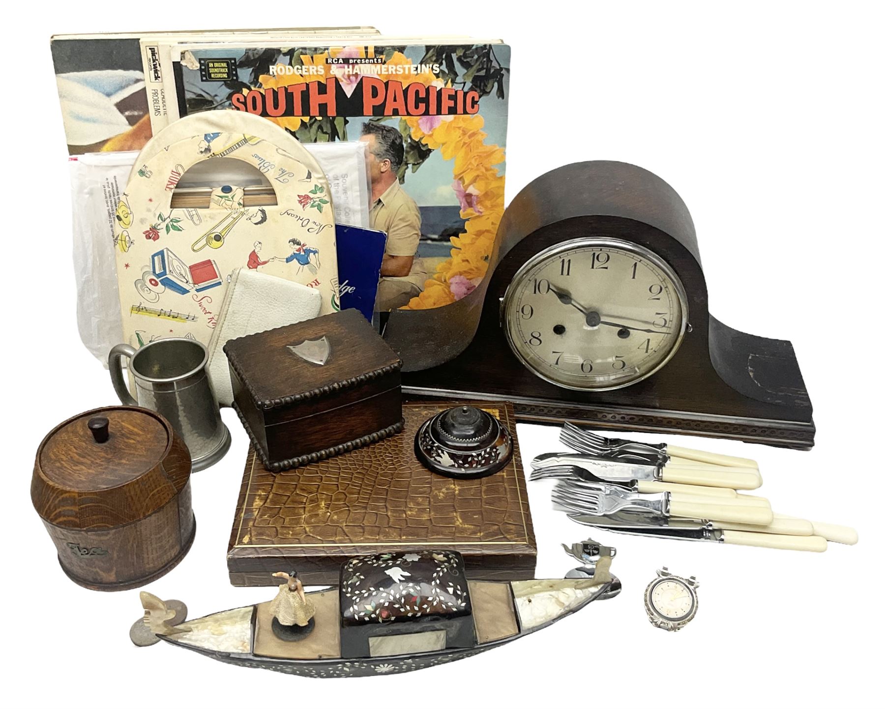 Mid 20th century cigarette box in the form of a gondola, the faux tortoiseshell with mother of pearl inlay (a/f), cased mantel clock with silvered numerical dial, oak lidded tea jar caddy, oak box, silver-plate cutlery, quantity of records, Smith's empire miniature clock, stamps etc