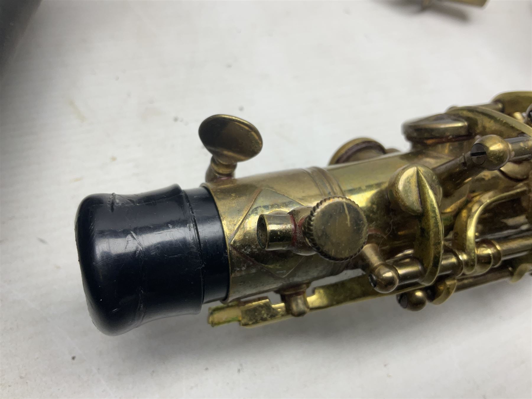 Lacquered brass 'King' alto saxophone inscribed Made by the H.N. White Co.' (Cleveland Ohio) with crook, serial no.84128; also stamped No.1 549 911 and Pat D 8-18-25; in fitted carrying case 