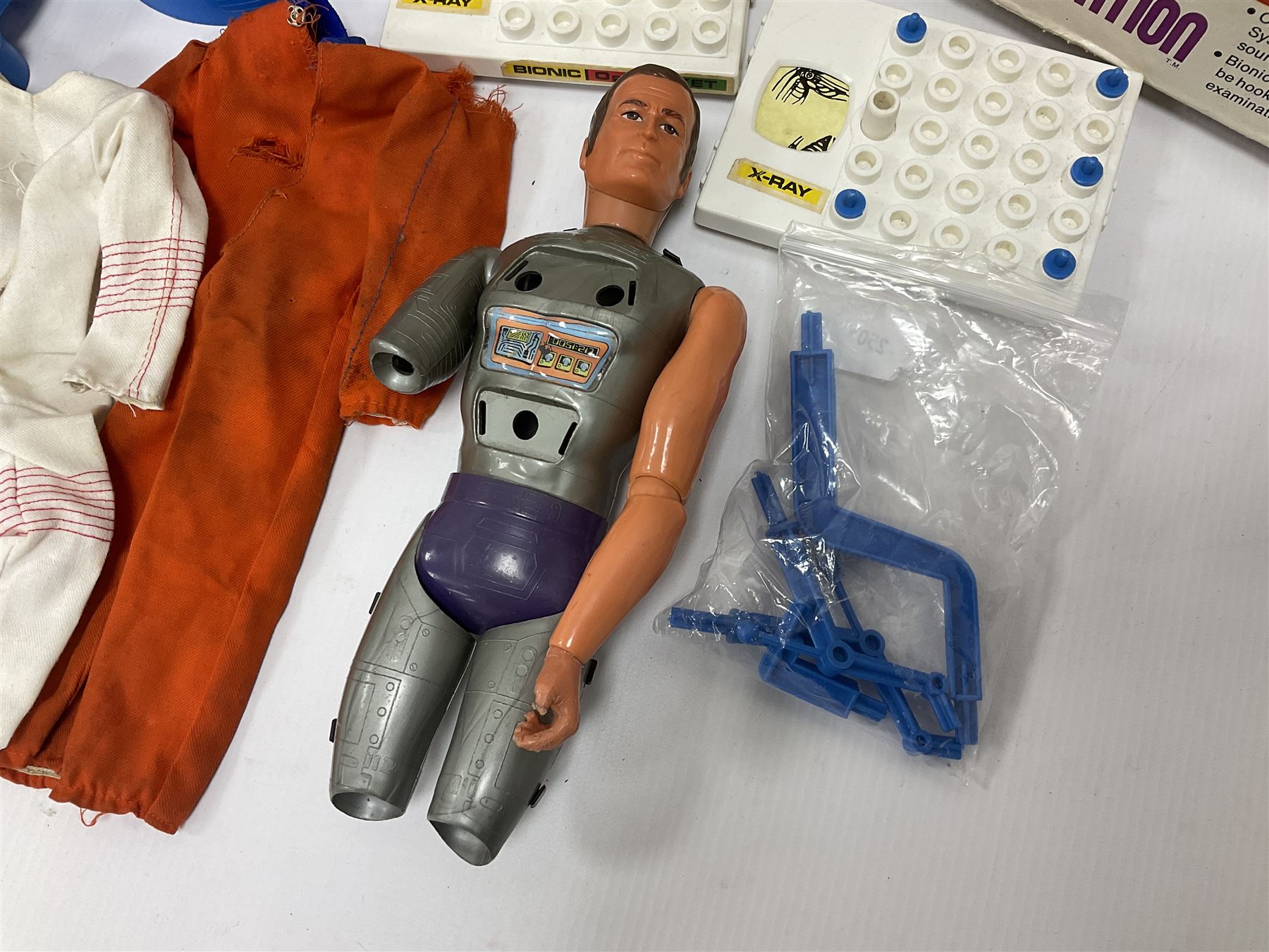Six Million Dollar Man - two 1975 Bionic Transport and Repair Stations with related figures, further accessories and boxes