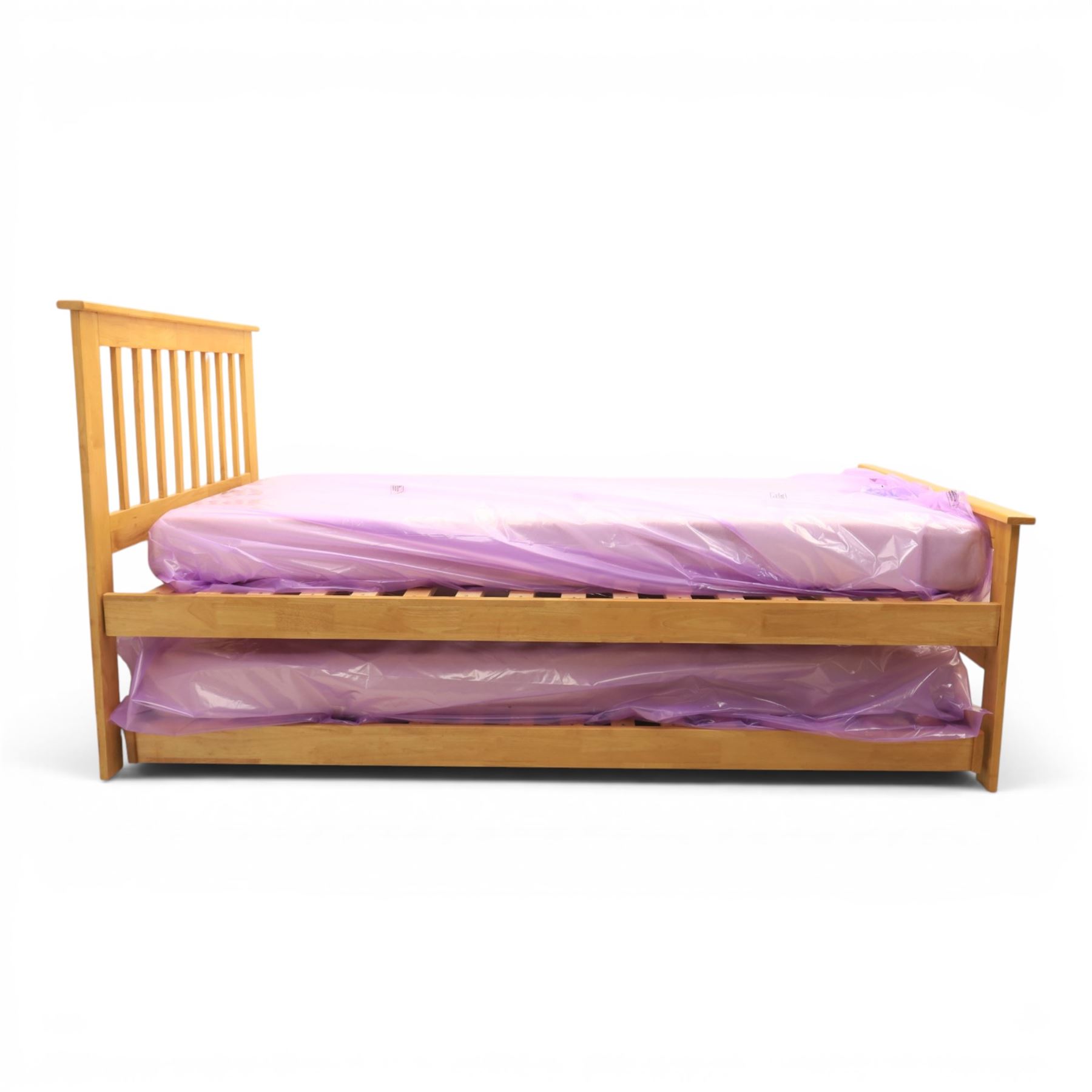 Contemporary light oak trundle bed, slatted headboard and footboard,  incorporating pull-out trundle bed on castors, complete with two memory foam mattresses