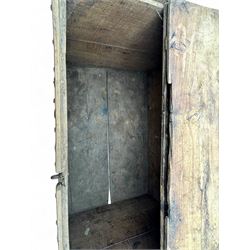 Late 19th century Afghan carved hardwood storage chest, the hinged plank top enclosing large internal storage space, geometric carvings to the front panels decorated with rows of riveted iron bosses