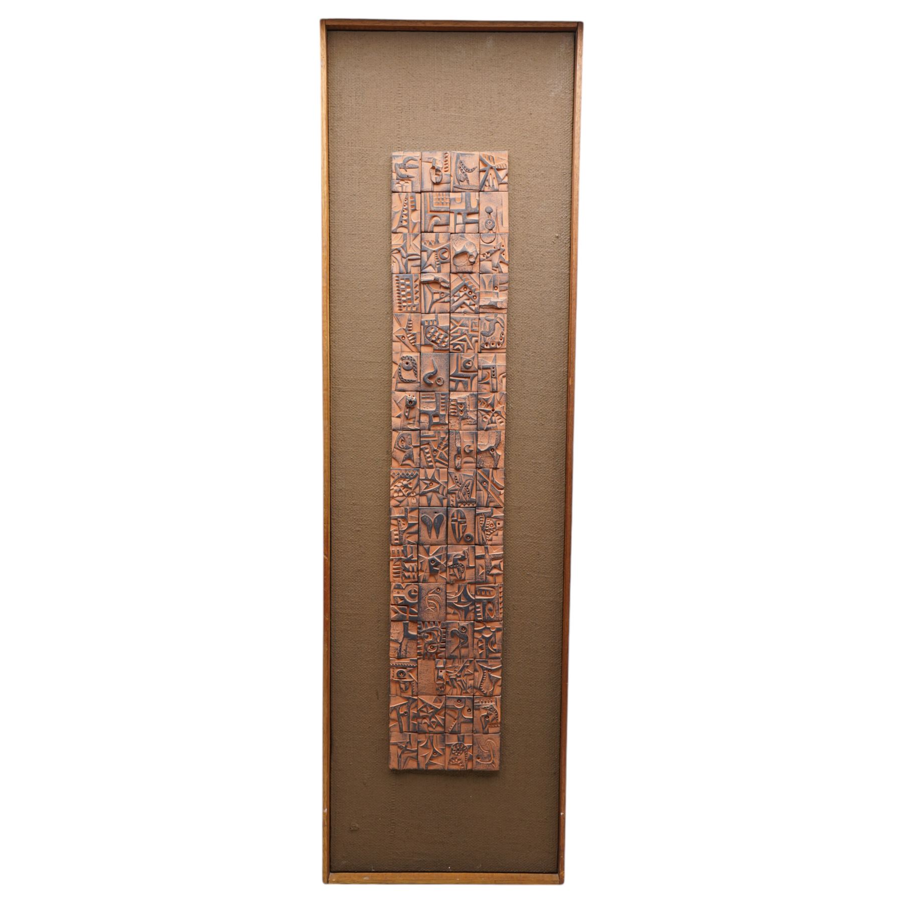 Ron Hitchins (British 1926-2019): Abstract Terracotta Tile Composition, mixed media tile collage on board signed verso 73cm x 14cm