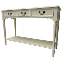 Laura Ashley - 'Clifton' ivory finish three drawer console table, fitted with three frieze drawers with heavily moulded edges, raised on turned supports united by undertier
