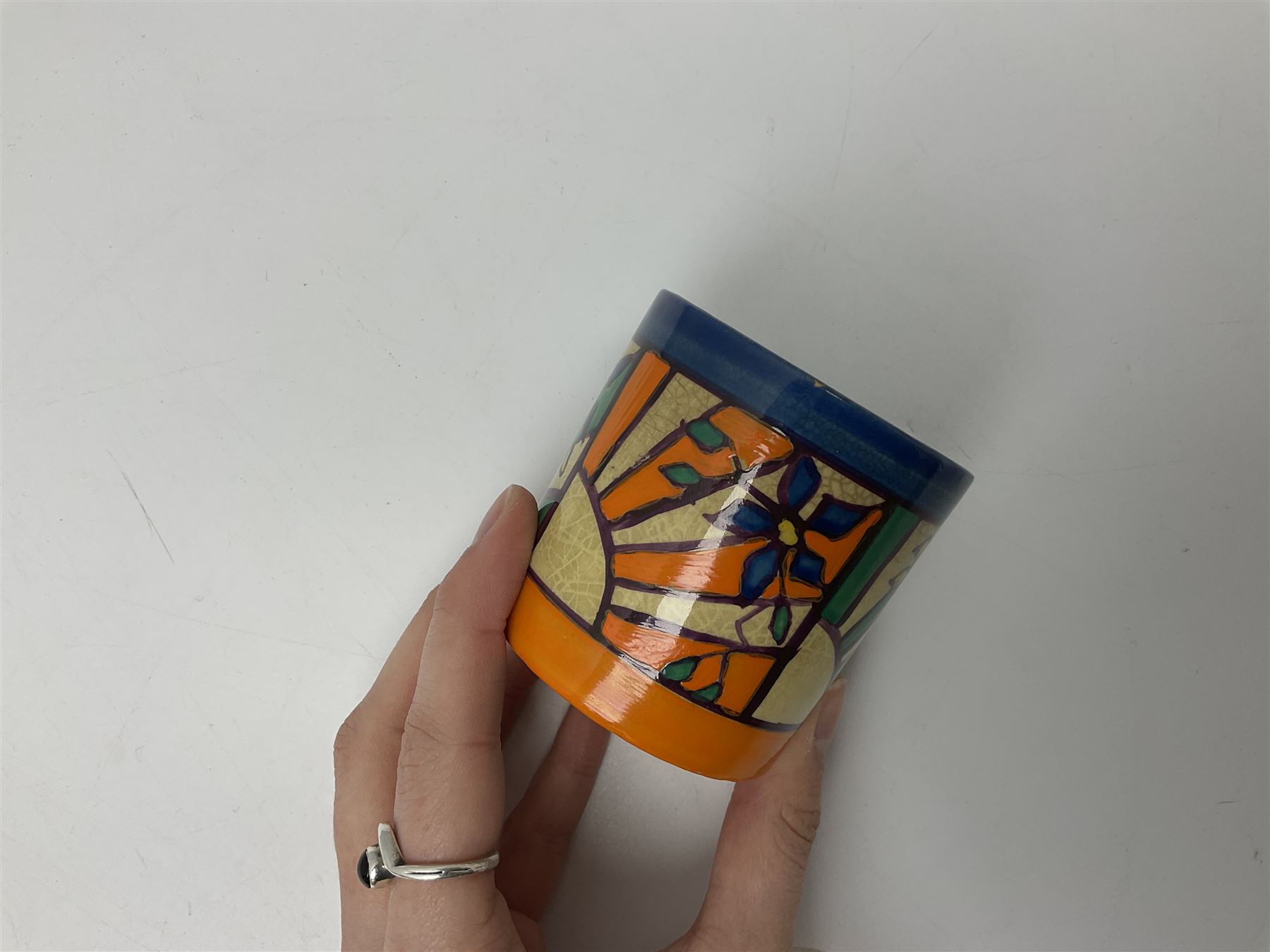 Clarice Cliff Fantasque for Wilkinson Pottery preserve pot, circa 1928, of drum form decorated in Sunray Leaves pattern, H8cm