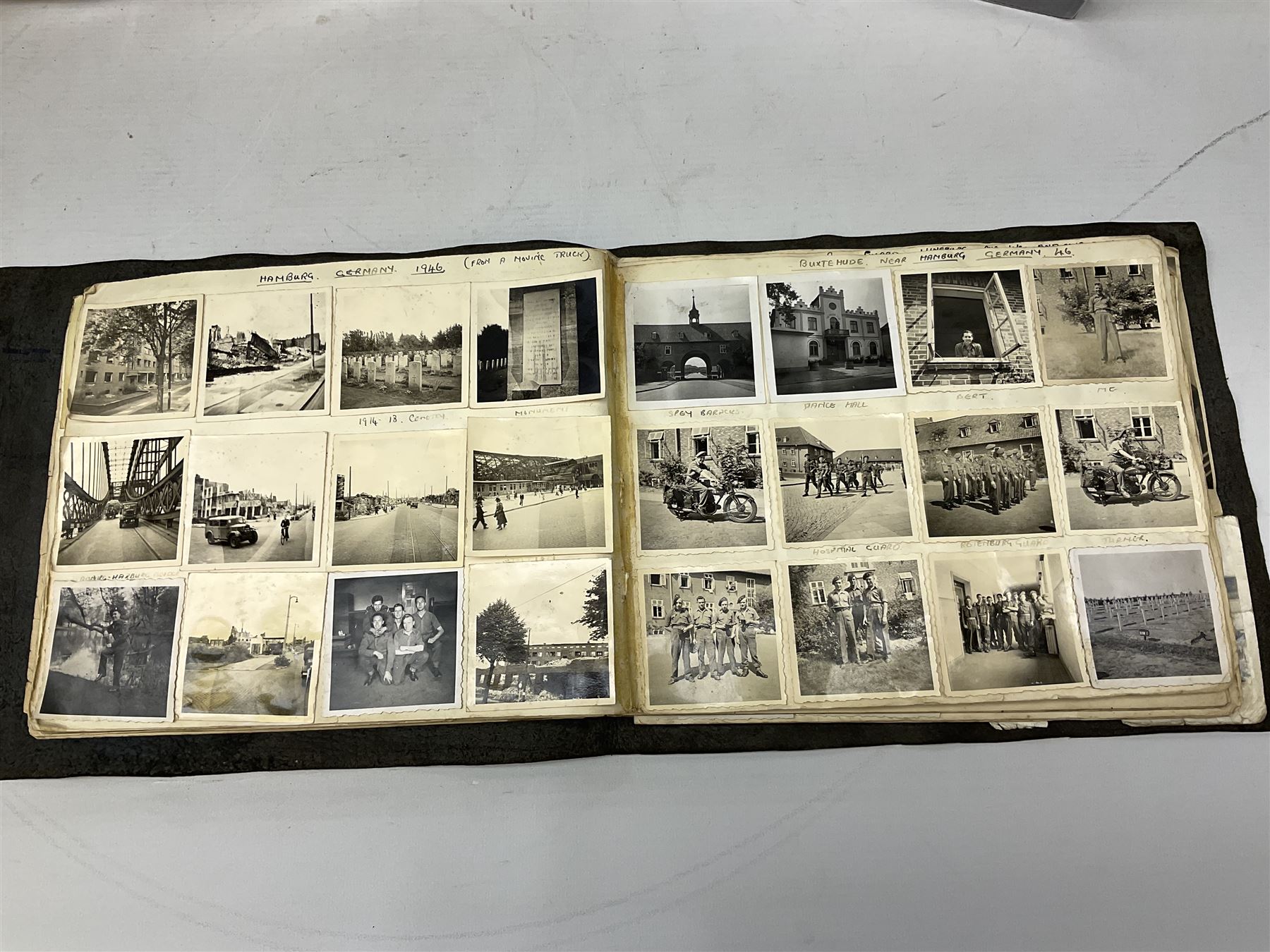 Postcards and postal history, including WWII period items, topographical postcards, military themed postcards including 'Daily Mail Battle Picture', 'War Bond Campaign Post Card' etc, housed in three ring binder albums, and an album containing various photos of men in military uniform dating from the late 1940s