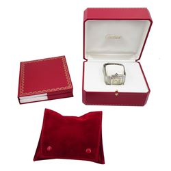 Cartier Santos Galbée gentleman's stainless steel automatic wristwatch, Ref. 2319, silvered guilloche dial with Roman numerals and secret signature at 7 o'clock, boxed purchase certificate dated 2003, pouch and service receipt dated September 2023