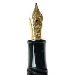Montblanc Meisterstück Oscar Wilde limited edition fountain pen, black resin cap and barrel with marbled ivory and black patterned lower barrel and gold-plated fittings, the cap signed with Oscar Wilde facsimile and surmounted by the white star emblem, fitted with a medium 18K (750) gold nib engraved 4810, 1994 and MONTBLANC, model no. 28616, presented in original lined fitted case in the form of a book with outer box
