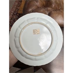 Chinese Kangxi famille verte plate, decorated with a bird perched upon a blossoming branch, within an iron red foliate border, D22cm