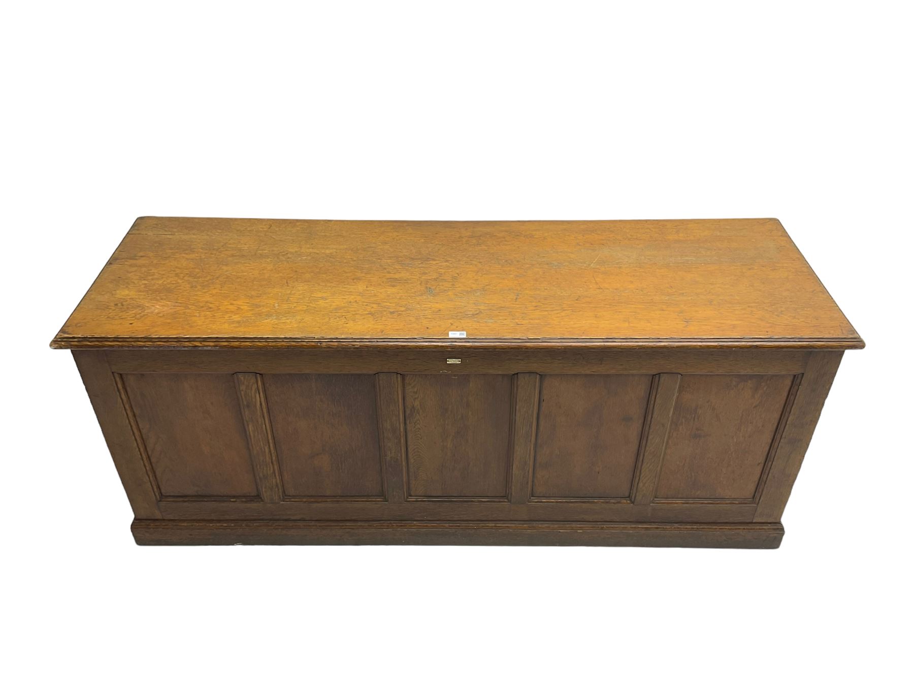 Illingworth Ingham and Co. School Furnishers (Leeds c1900) - early 20th century oak rostrum or headmaster's desk, rectangular top, the front and sides panelled with open reverse, on plinth base