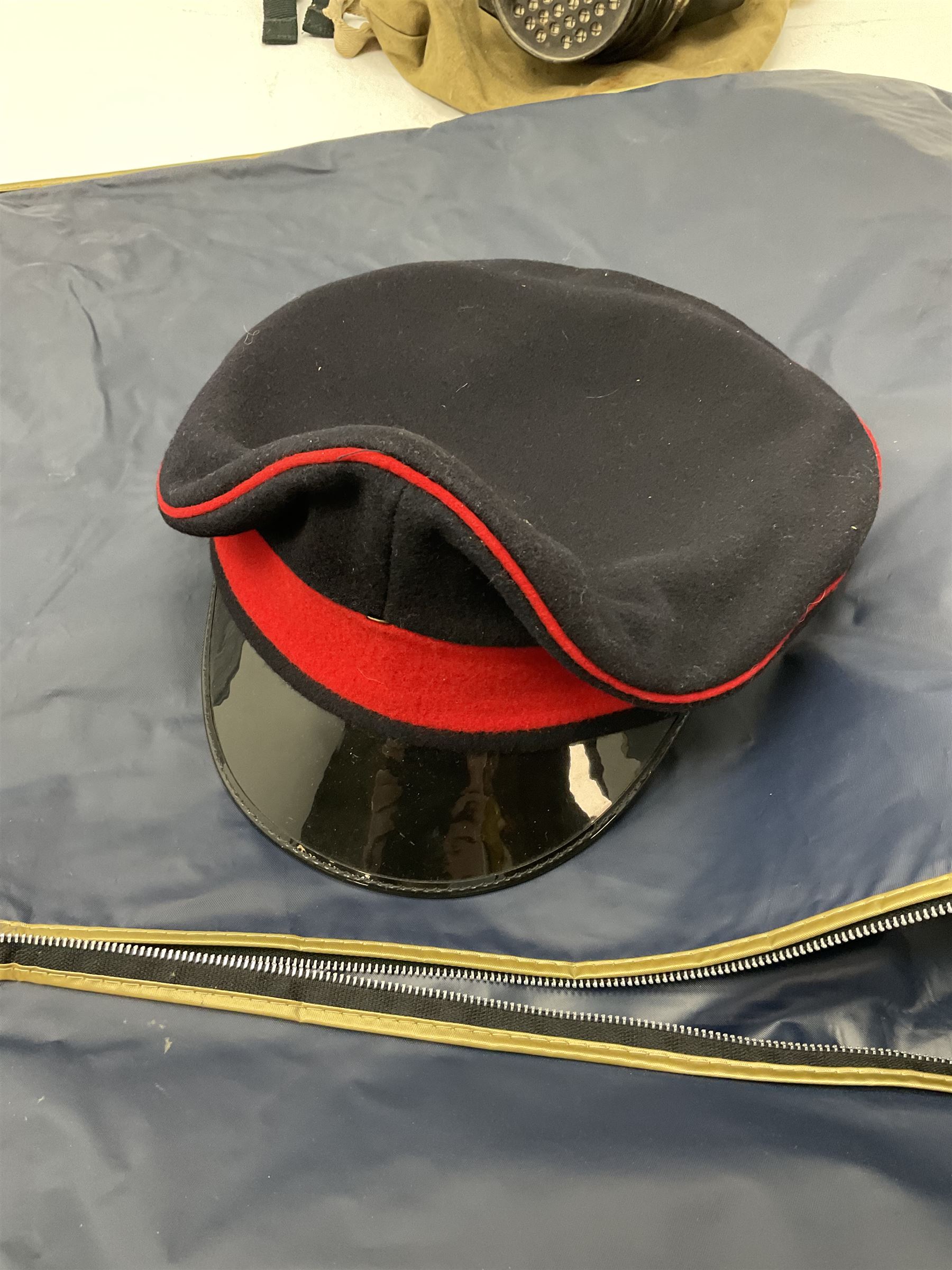 RAF Flight Lieutenant's uniform with peaked cap and WW2 ribbon bar; WW2 gas mask in blue canvas bag dated 1942; flying helmet date 1984; and British Army Major's uniform with Staybrite buttons and peaked cap