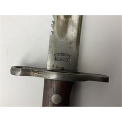 Swiss Schmidt-Rubin M1914 pioneer bayonet, with 48cm steel saw-back blade, the ricasso stamped, ''Waffenfabrik, Neuhausen'', the crosspiece stamped Swiss cross, steel scabbard, leather frog L64cm overall
