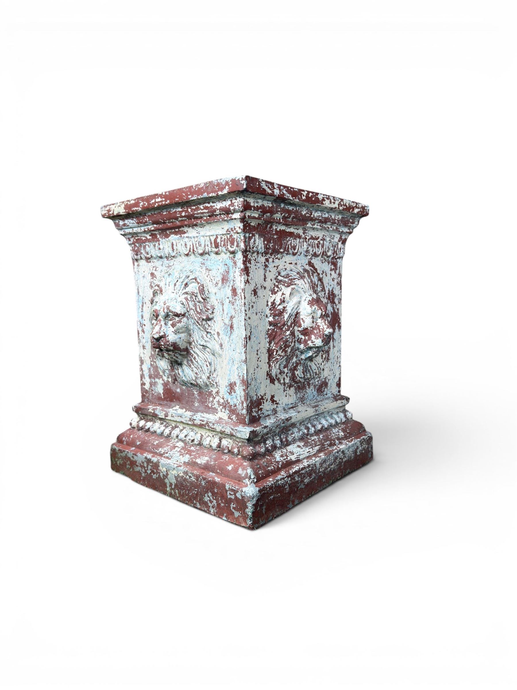 Early 20th century terracotta pedestal, square form with egg and dart detail, four lions masks to either side, finished in distressed cream paint