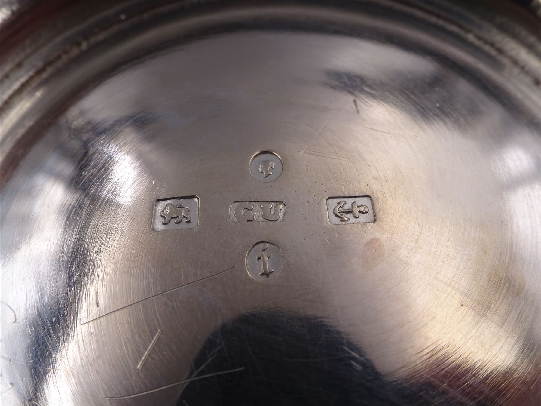 Victorian silver bowl, with embossed floral decoration and beaded rim, gilt interior and two applied shield cartouches, upon stepped circular foot, with a silver apostle spoon, with gilt bowl, both hallmarked George Unite, Birmingham 1883, bowl H5.5cm, within fitted tooled leather, silk lined case