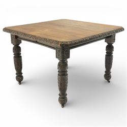 19th century heavily carved oak extending dining table, with winding mechanism and a gadrooned edge, over block and turned supports terminating in castors, extends to 147cm