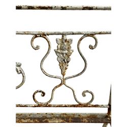Regency design wrought metal garden bench, central lyre back with foliate S-scrolls with serpent masks, flanked by two floral mouldings and further scrolling, metal slatted seat on straight supports joined by H-stretcher  - THIS LOT IS TO BE COLLECTED BY APPOINTMENT FROM DUGGLEBY STORAGE, GREAT HILL, EASTFIELD, SCARBOROUGH, YO11 3TX