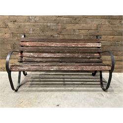 Early 20th century black painted wrought iron and wood slatted garden bench